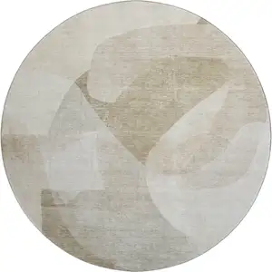 Photo of 8' Beige And Ivory Abstract Washable Round Rug With UV Protection