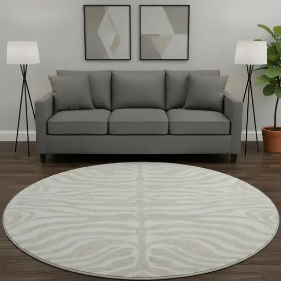 8' Beige And Ivory Animal Print Washable Round Rug With UV Protection Photo 2