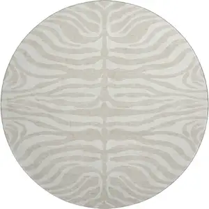 Photo of 8' Beige And Ivory Animal Print Washable Round Rug With UV Protection