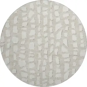 Photo of 8' Beige And Ivory Cobblestone Washable Round Rug With UV Protection
