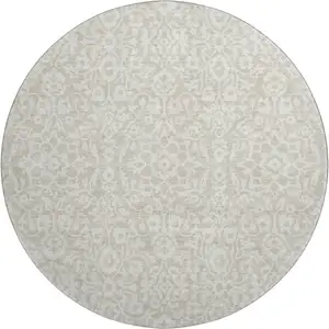Photo of 8' Beige And Ivory Damask Washable Round Rug With UV Protection