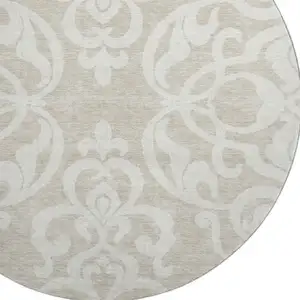 Photo of 8' Beige And Ivory Damask Washable Round Rug With UV Protection