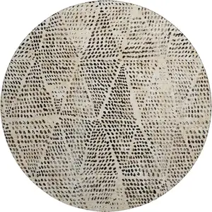 Photo of 8' Beige And Ivory Diamond Washable Round Rug With UV Protection