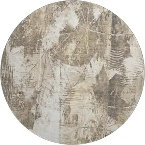 Photo of 8' Beige And Ivory Floral Washable Round Rug With UV Protection
