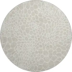 Photo of 8' Beige And Ivory Geometric Washable Round Rug With UV Protection