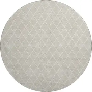 Photo of 8' Beige And Ivory Geometric Washable Round Rug With UV Protection
