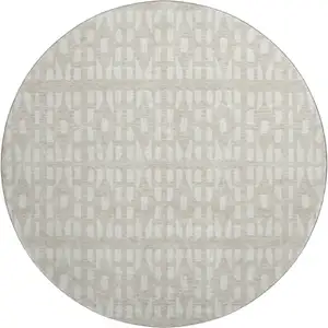Photo of 8' Beige And Ivory Geometric Washable Round Rug With UV Protection