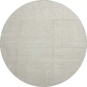 Photo of 8' Beige And Ivory Geometric Washable Round Rug With UV Protection
