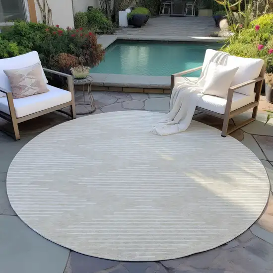8' Beige And Ivory Round Geometric Washable Indoor Outdoor Area Rug Photo 6