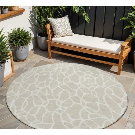 8' Beige And Ivory Round Geometric Washable Indoor Outdoor Area Rug Photo 1