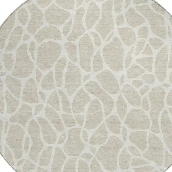 8' Beige And Ivory Round Geometric Washable Indoor Outdoor Area Rug Photo 4