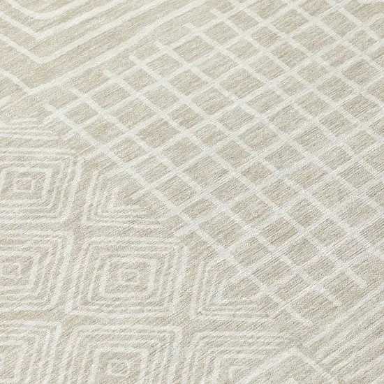 8' Beige And Ivory Round Geometric Washable Indoor Outdoor Area Rug Photo 8