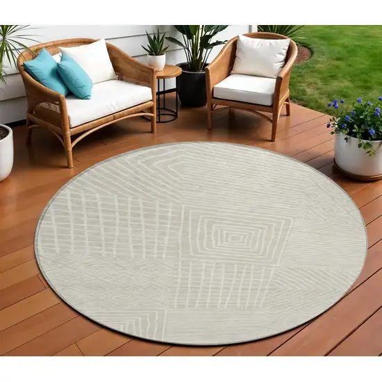 8' Beige And Ivory Round Geometric Washable Indoor Outdoor Area Rug Photo 1