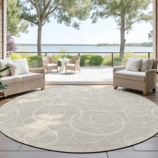 8' Beige And Ivory Round Geometric Washable Indoor Outdoor Area Rug Photo 4