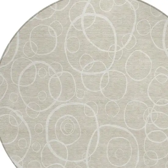 8' Beige And Ivory Round Geometric Washable Indoor Outdoor Area Rug Photo 2