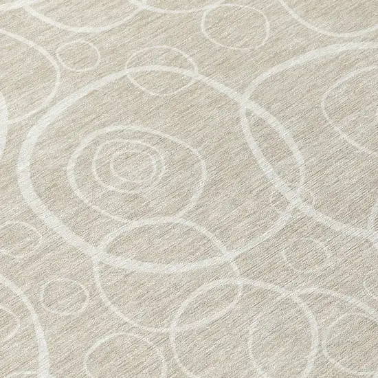8' Beige And Ivory Round Geometric Washable Indoor Outdoor Area Rug Photo 9