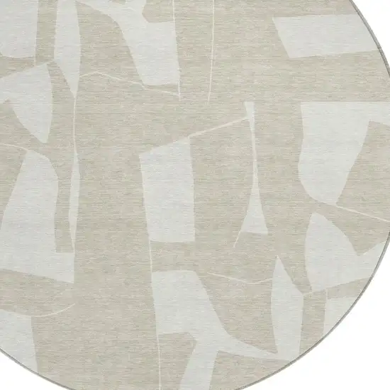 8' Beige And Ivory Round Geometric Washable Indoor Outdoor Area Rug Photo 2