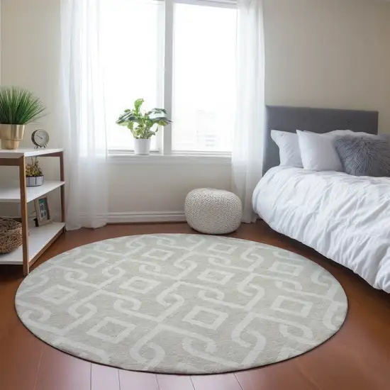 8' Beige And Ivory Round Geometric Washable Indoor Outdoor Area Rug Photo 6