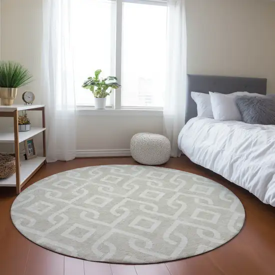 8' Beige And Ivory Round Geometric Washable Indoor Outdoor Area Rug Photo 6