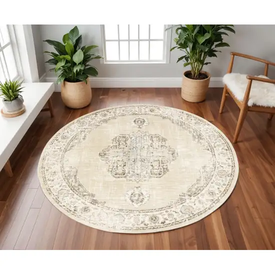 8' Beige and Ivory Round Oriental Power Loom Area Rug Photo 1