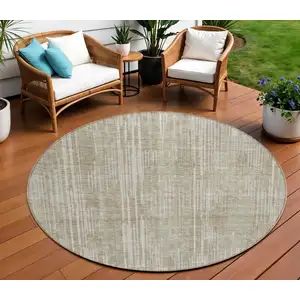 Photo of 8' Beige And Ivory Round Striped Washable Indoor Outdoor Area Rug