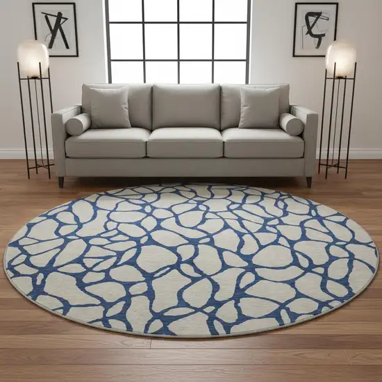 8' Beige And Navy Blue Geometric Washable Round Rug With UV Protection Photo 2