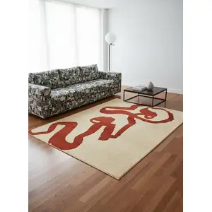 Photo of 8' Beige And Red Abstract Washable Round Rug With UV Protection