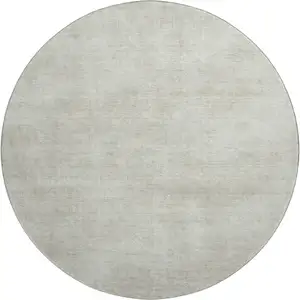 Photo of 8' Beige And Taupe Abstract Washable Round Rug With UV Protection