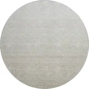 Photo of 8' Beige And Taupe Ombre Washable Round Rug With UV Protection