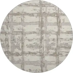 Photo of 8' Beige And Taupe Striped Washable Round Rug With UV Protection