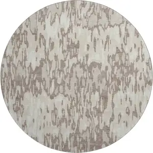 Photo of 8' Beige And Taupe Striped Washable Round Rug With UV Protection