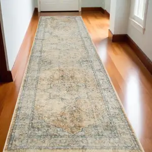 Photo of 10' Beige Blue And Brown Floral Medallion Washable Runner Rug