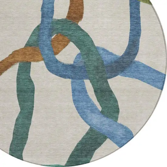 8' Beige Blue And Green Round Abstract Washable Indoor Outdoor Area Rug Photo 2