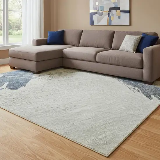 8' Beige Blue And Ivory Abstract Washable Area Rug With UV Protection Photo 2
