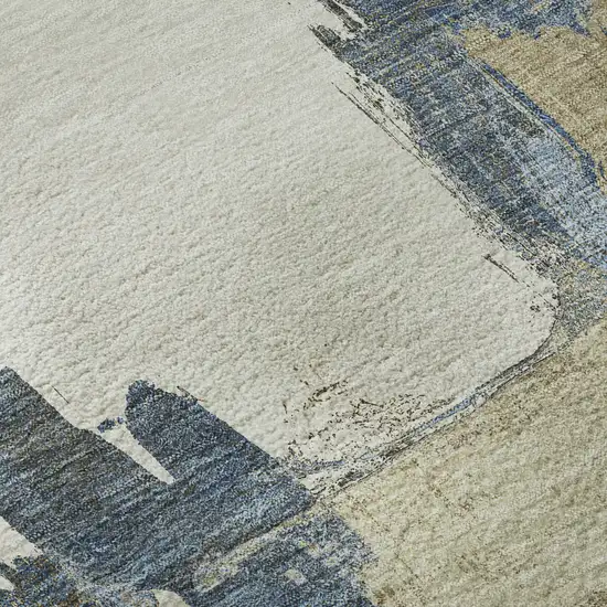 8' Beige Blue And Ivory Abstract Washable Area Rug With UV Protection Photo 1
