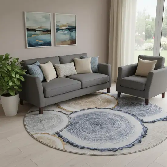 8' Beige Blue And Ivory Woodland Lodge Washable Round Rug With UV Protection Photo 1