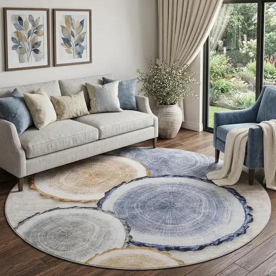 8' Beige Blue And Ivory Woodland Lodge Washable Round Rug With UV Protection Photo 1