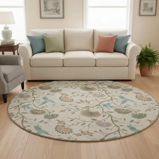 8' Beige Blue And Peach Geometric Washable Round Rug With UV Protection Photo 1