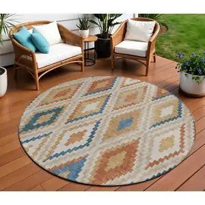 Photo of 8' Beige Blue And Terra Cotta Round Geometric Washable Indoor Outdoor Area Rug