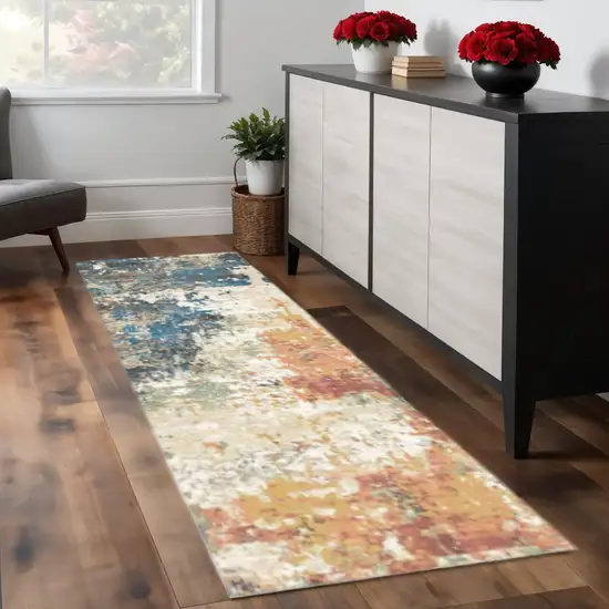 8' Beige Blue and Ivory Abstract Distressed Runner Rug With Fringe Photo 1