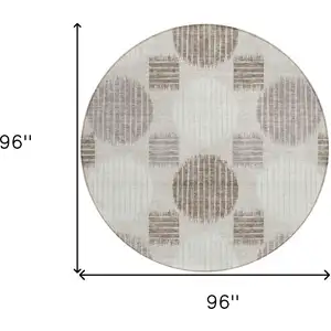 Photo of 8' Beige Brown And Ivory Round Geometric Washable Indoor Outdoor Area Rug