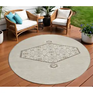 Photo of 8' Beige Brown And Ivory Round Oriental Washable Indoor Outdoor Area Rug
