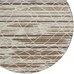Photo of 8' Beige Brown And Ivory Round Striped Washable Indoor Outdoor Area Rug