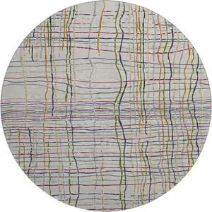 Photo of 8' Beige Gold And Blue Striped Washable Round Rug With UV Protection