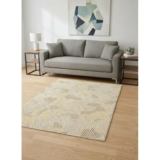8' Beige Gold And Brown Geometric Washable Round Rug With UV Protection Photo 1