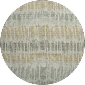Photo of 8' Beige Gold And Gray Striped Washable Round Rug With UV Protection