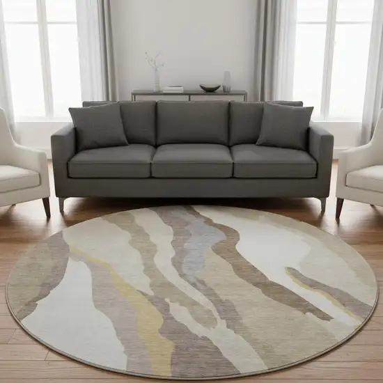 8' Beige Gold And Taupe Abstract Washable Round Rug With UV Protection Photo 2