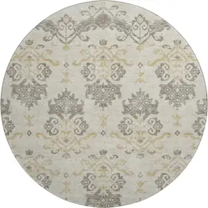Photo of 8' Beige Gold And Taupe Medallion Washable Round Rug With UV Protection
