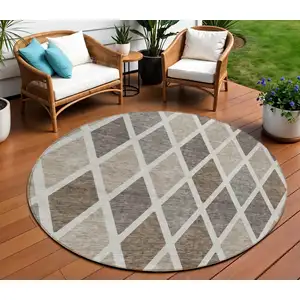 Photo of 8' Beige Gray And Brown Round Geometric Washable Indoor Outdoor Area Rug