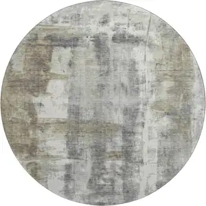 Photo of 8' Beige Gray And Ivory Abstract Washable Round Rug With UV Protection